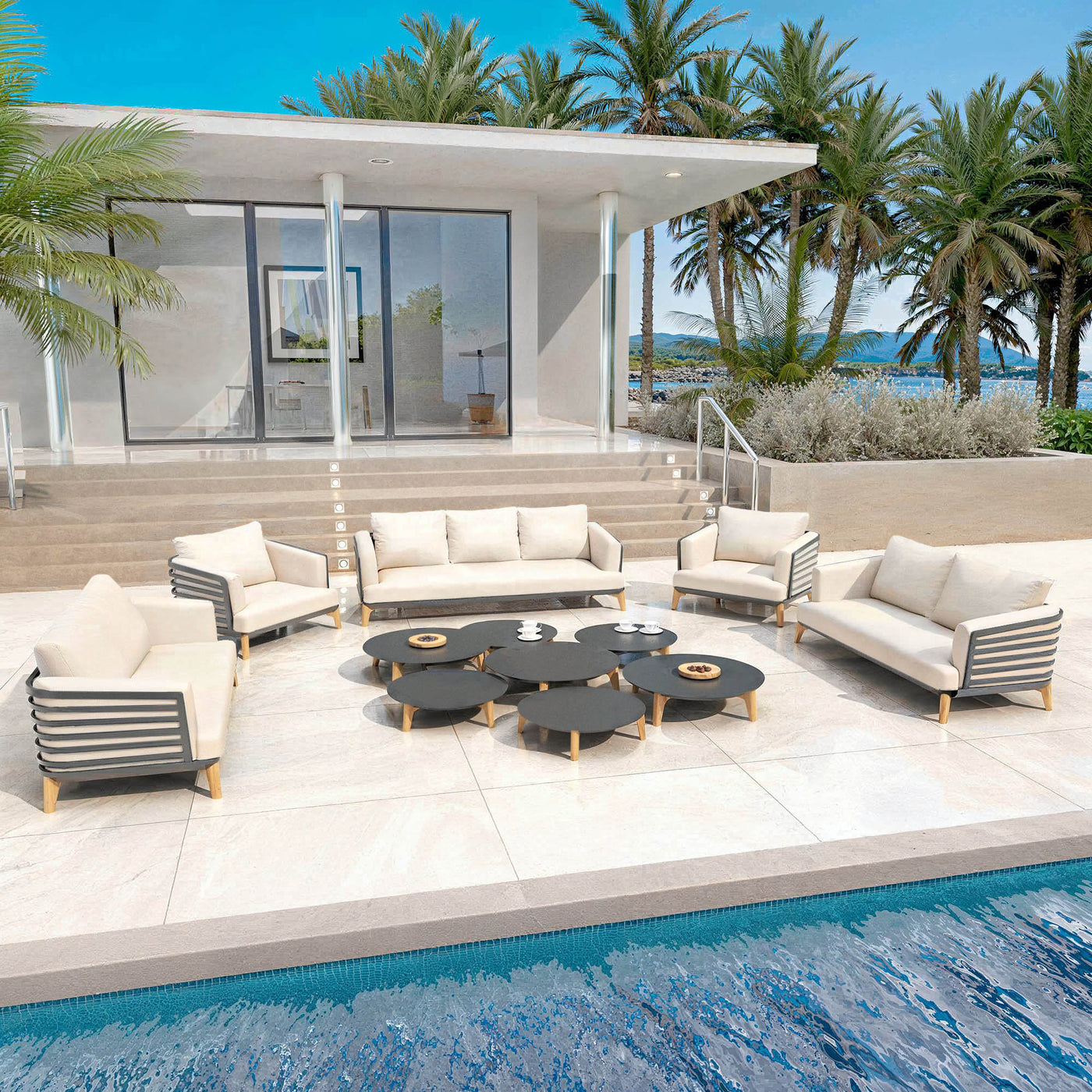 Salon de jardin Monte Carlo 9 places Meublot avec fauteuils en anthracite et coussins beiges, ensemble d'extérieur moderne.