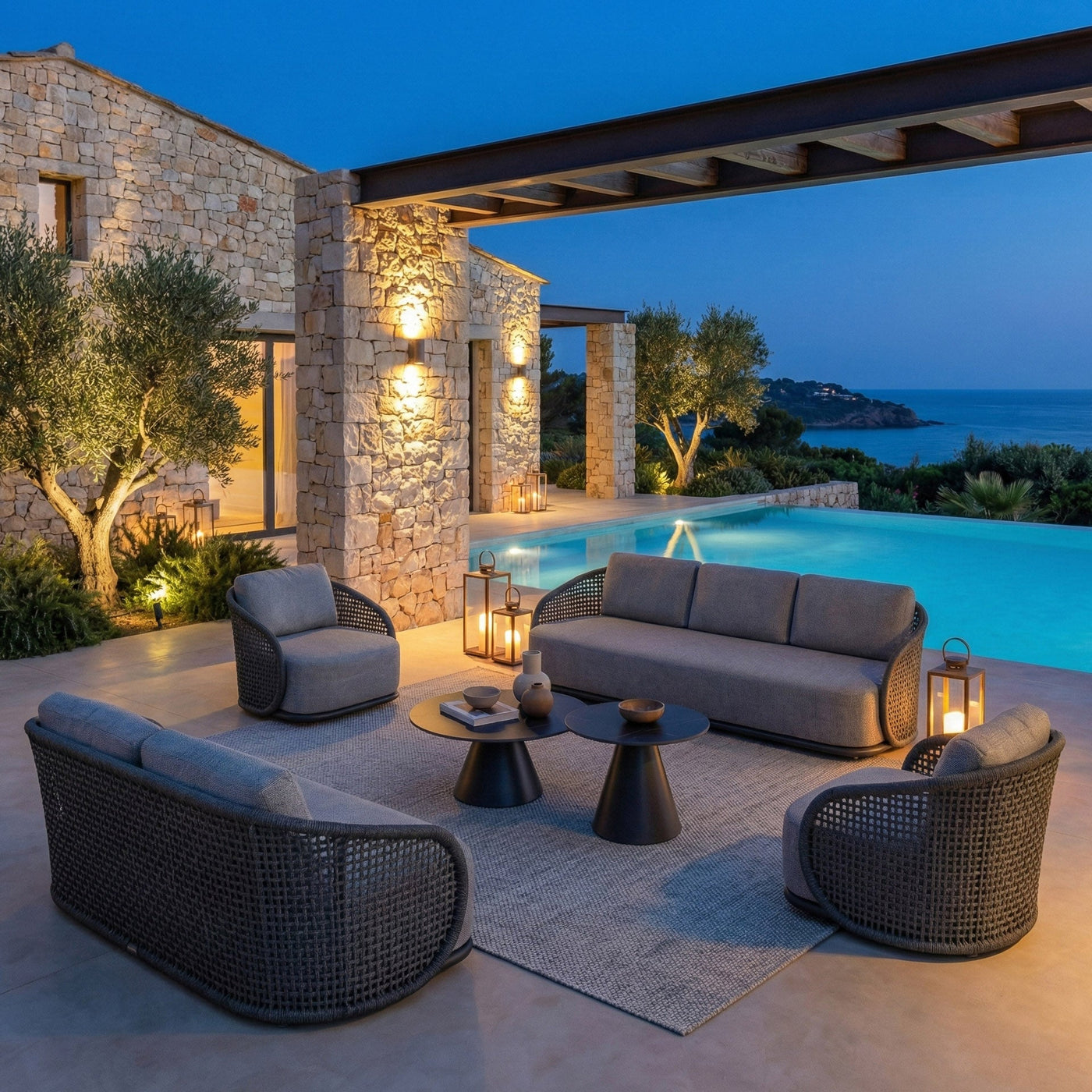 Salon de jardin Riviera 7 places de Meublot avec mobilier en anthracite, idéal pour l'extérieur, vue de l'ensemble du salon.