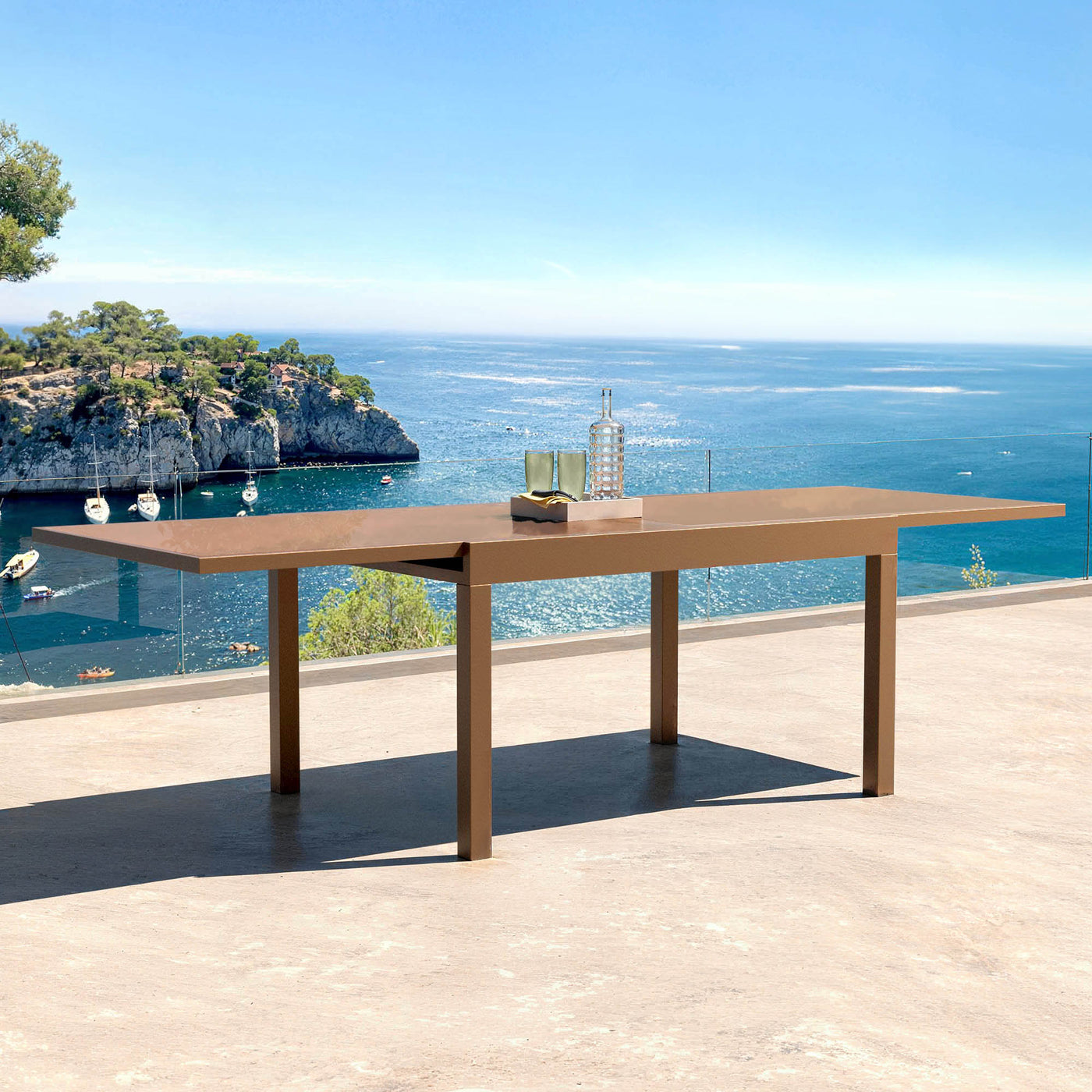 Table de jardin extensible Meublot Murano pour 10 personnes, en verre Murano brun, dimensions 270 x 90 cm.