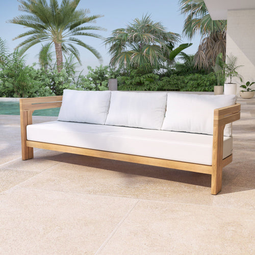 Canapé 3 places en teck Zanzibar de Meublot, structure en bois naturel avec coussins blancs visibles.