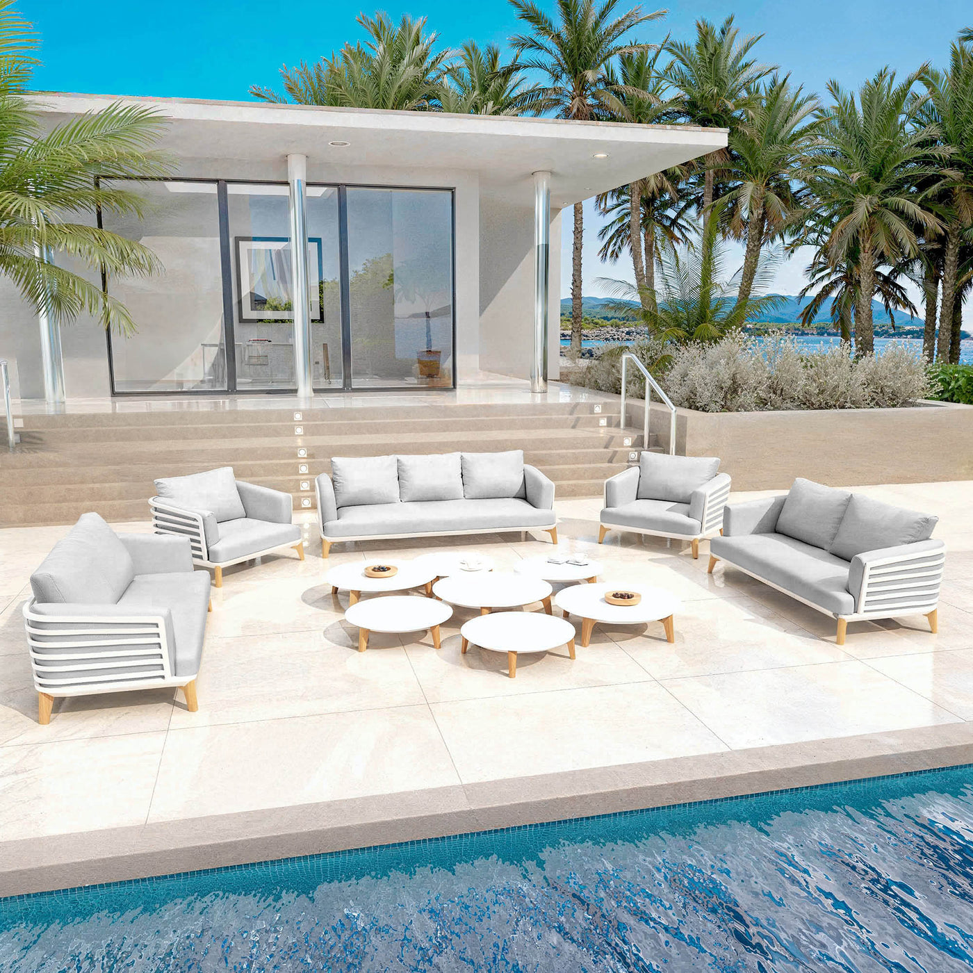 Salon de jardin Monte Carlo 9 places de Meublot avec table blanche et chaises gris nuage, parfait pour l'extérieur.