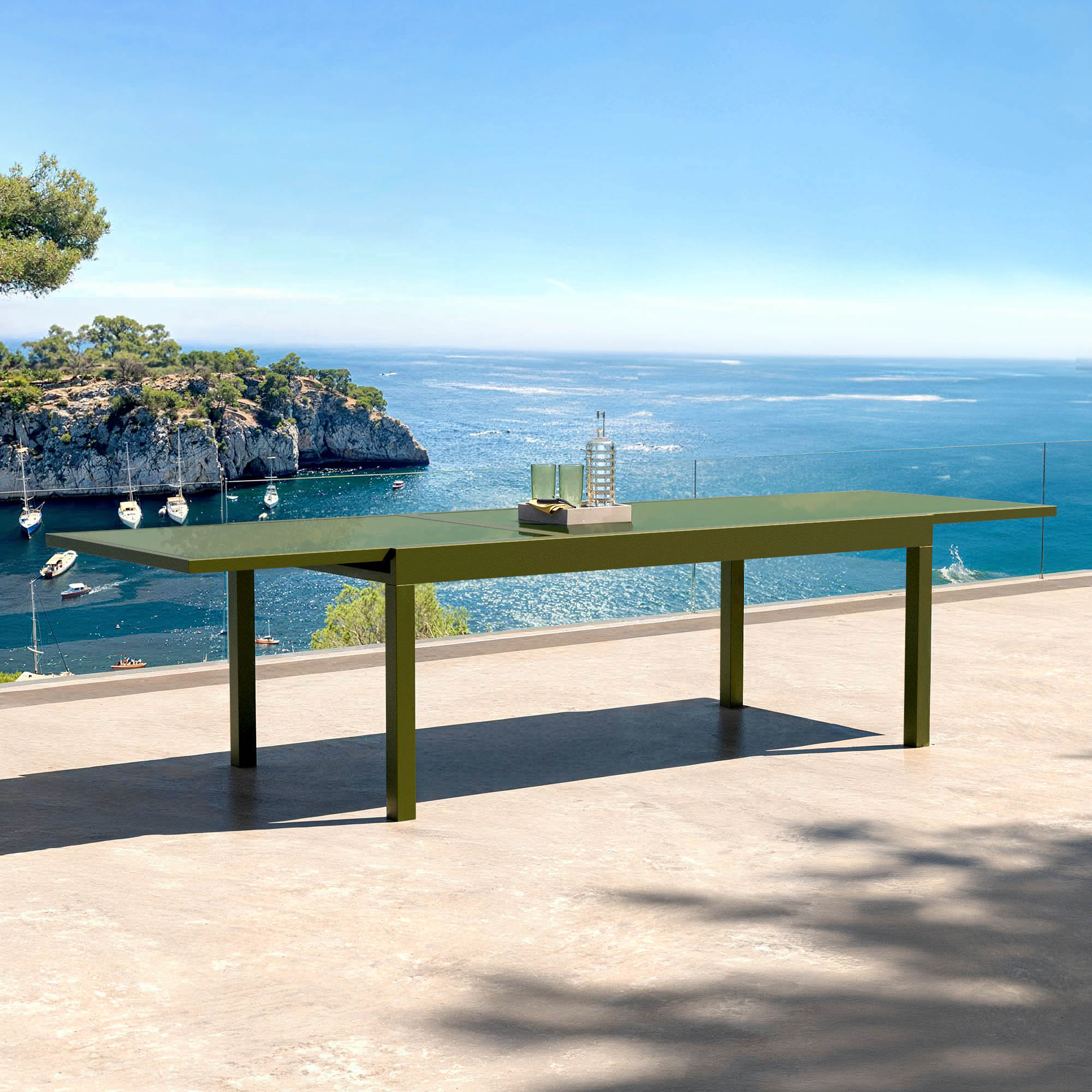 Table de jardin extensible Meublot pour 12 personnes avec plateau en verre Murano vert, dimensions 320 x 100 cm.